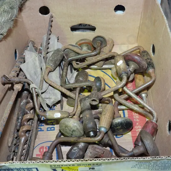 box; rusty drill braces, auger