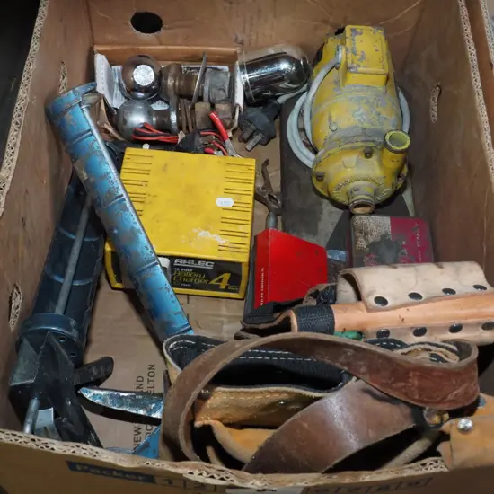 box; builder's belts, caulking guns, tow balls etc