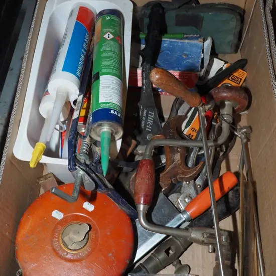 box; silicon sealants, bow saw, builder's tape etc