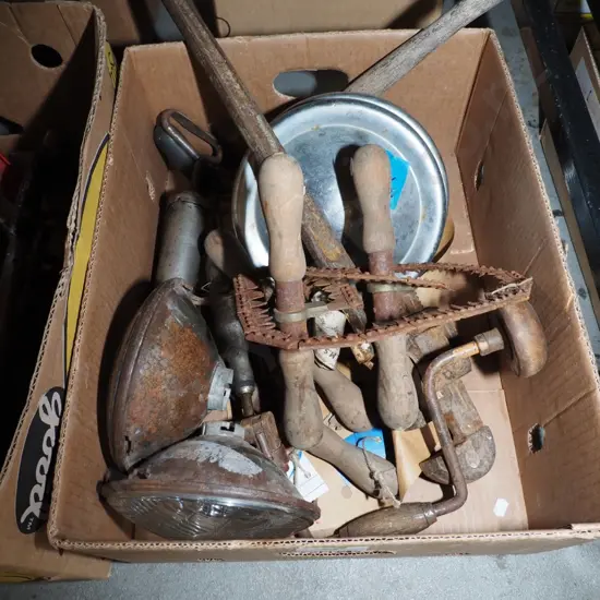 box; hub caps, head lights, rusty plumbers stilson etc