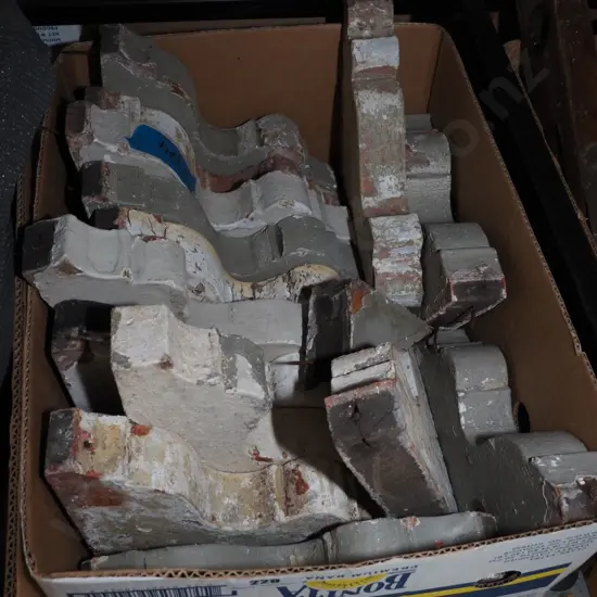box of wooden architectural brackets