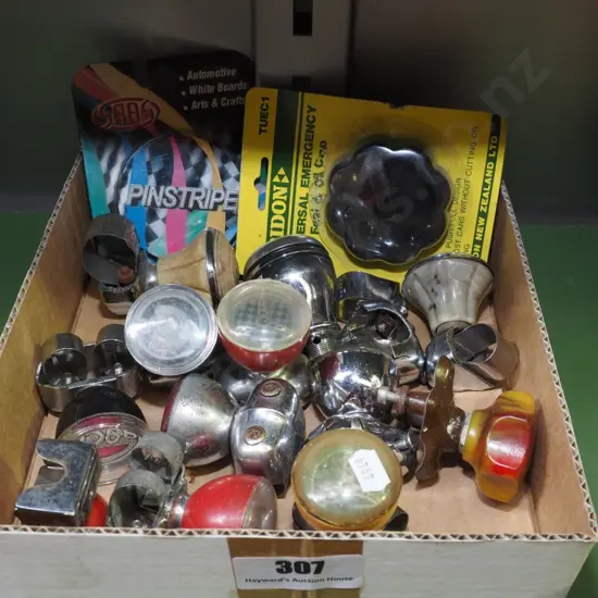 box of steering wheel knobs, pin caps etc