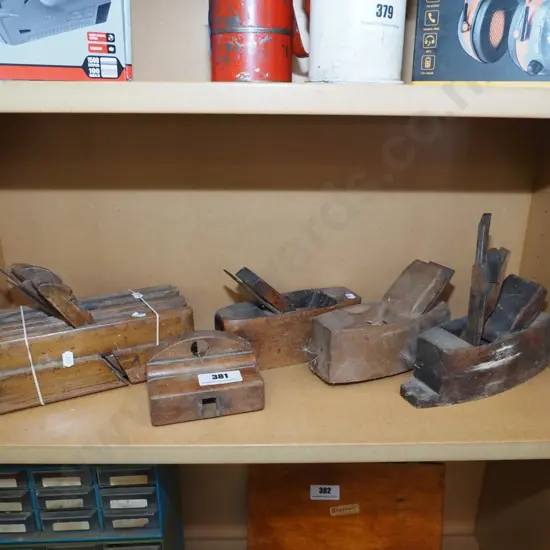 shelf of vintage hand planes