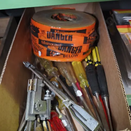 box; electrical cable tape, chainsaw sharpener, chisels 