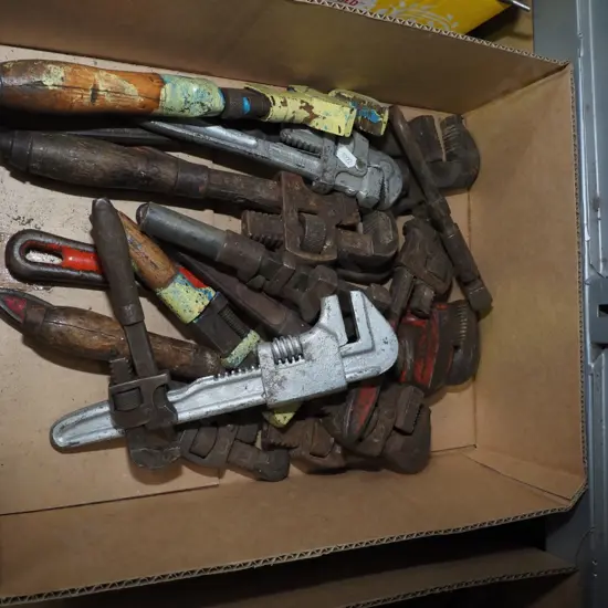 box of plumber's stilsons