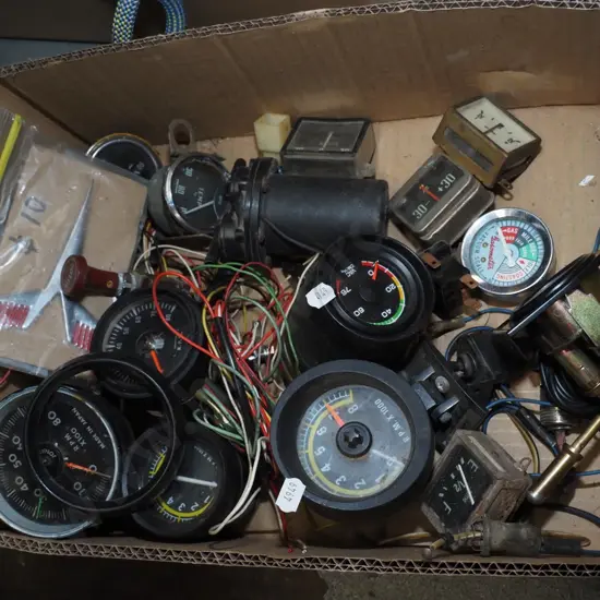 box of automotive gauges