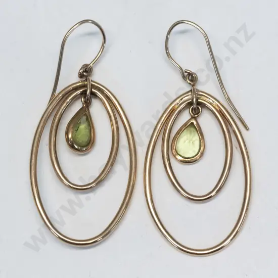 pair of peridot earrings stamped