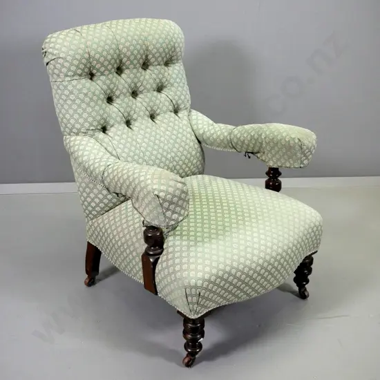 Victorian lounge chair with turned show-wood arms and legs, deep button back, green shell pattern damask