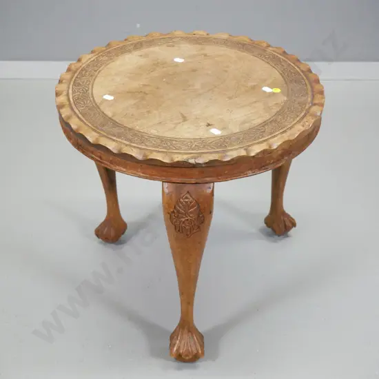 small mahogany end table with round top, waved edge & carved detail, ball and claw feet H-400 D-440