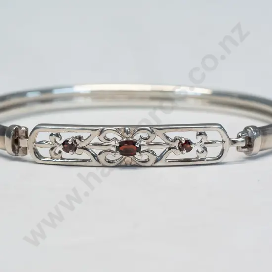silver bangle with 3 garnets