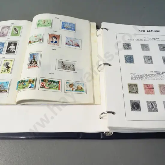 2 New Zealand stamp albums - earliest are 1873 newspaper stamp, 1880s postal stamps, health stamps etc.