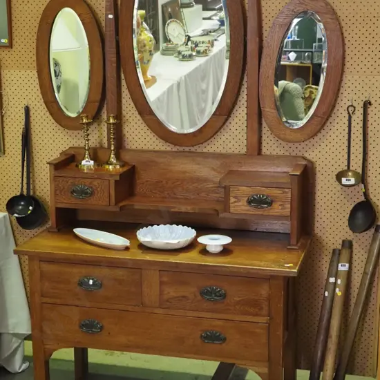 deco 3-drawer dressing table wth 2 small drawers on upstand back, with oval bevelled centre & winged mirrors, copper