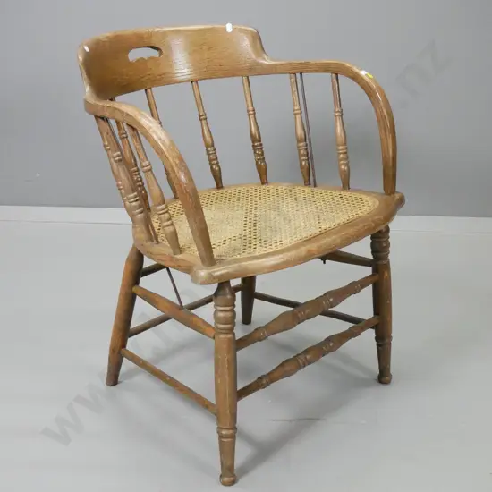 vintage oak captain's chair with bergere cane seat - some damage to timber around cane edge H710 W565 D500