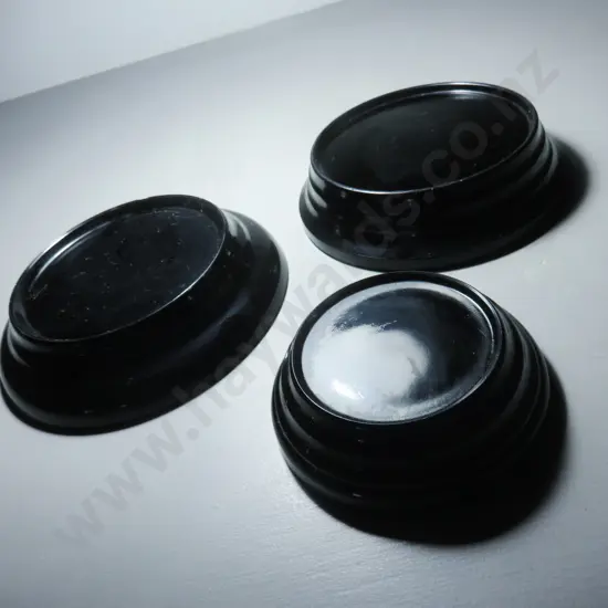 Trio of art deco black glass vase plinths