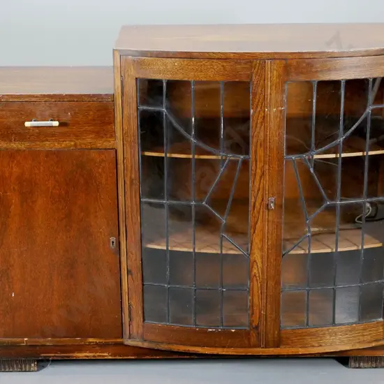 deco oak china cabinet 2 leadlight and one solid timber doors, bakelite handles, key. Polish needs attention H970 W1200