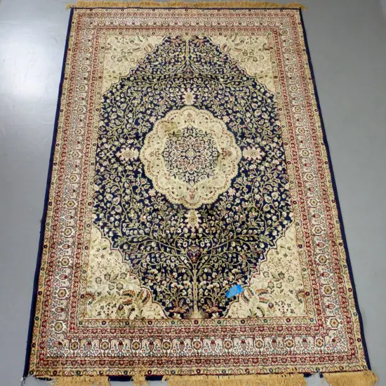 Persian style wool floor rug - red, blue and browns - some damage at one end L2270 W1540