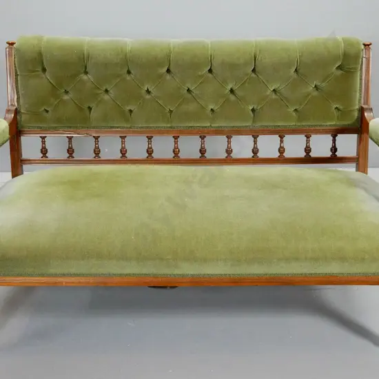 vintage settee with turned legs and spindles, deep button back, green velvet upholstery, on porcelain casters H810 W1380