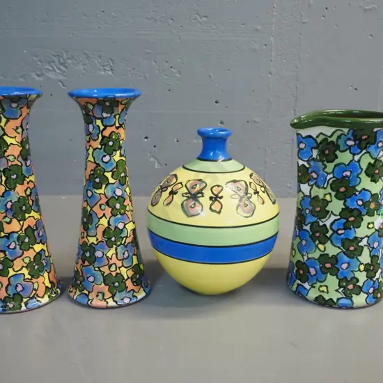 4 pieces Danny Moorwood multi colour floral studio pottery - jug, vase and a pair of candlesticks H-240