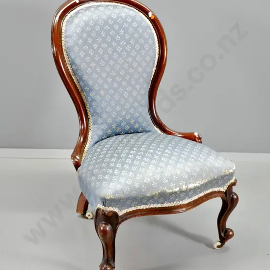 Victorian carved mahogany lady's chair, patterned damask, original porcelain casters, crack & movement in back H890 W540