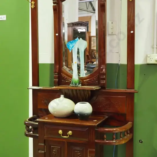 reproduction mahogany hall stand w/2-door cupboard, drawer, umbrella holders, bevelled mirror, brass coat hooks, carved