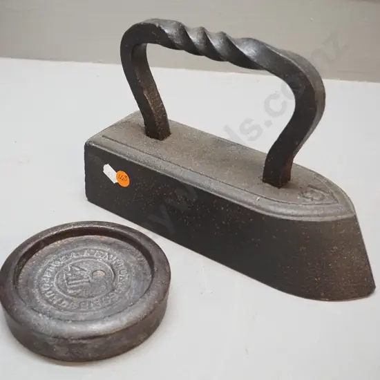 large heavy cast iron No. 18 sad iron with twist handle L-230 and a 4-lb. weight marked Kenrick & Sons