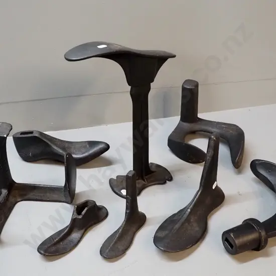 assorted cast iron shoe lasts and stand, one has damage
