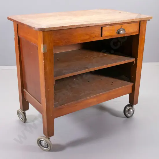 vintage kauri 2-drawer open-shelf work cabinet on large casters, ex chief post office, has some holes drilled, polish