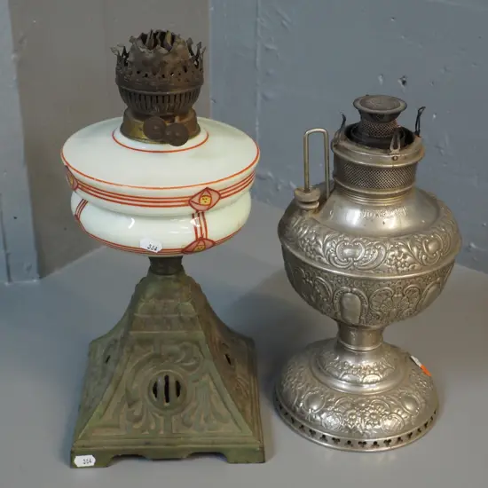 2 kerosene lamp bases, no chimneys - one pressed metal Miller USA and other art nouveau style glass on cast iron base