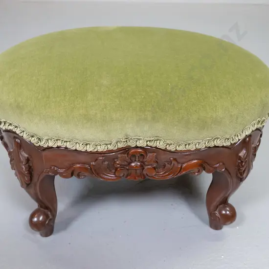 reproduction small Victorian style carved mahogany foot-stool with green velvet fabric H220 L340 W260