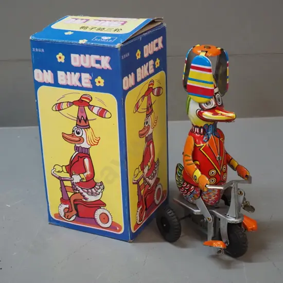 reproduction wind-up tin toy whirligig duck on tricycle - goes well H-210