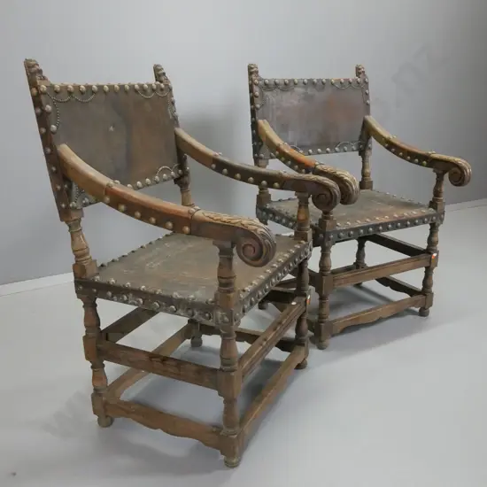 pair of vintage oak Tudor style chair armchairs w/ large brass-studded leather seat, back and arm caps H985 W580 D600