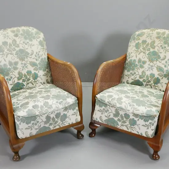mid-century beech cab-leg lounge chairs with coil sprung seats,  floral brocade, bergere cane sides, 1 has sagging seat