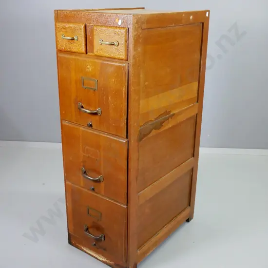 vintage oak filing cabinet with 3 file drawers, 2 small top drawers, one brass label holder has come off, polish needs