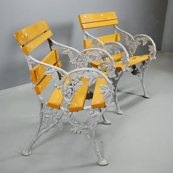 pair of garden seats with timber slat seat & back, blackberry-motif cast aluminium sides H790 W550 D570