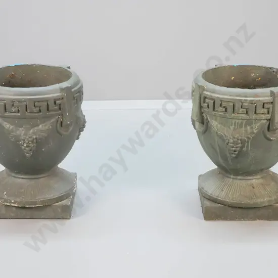 pair of classical style grape pattern green painted cast concrete garden urns on separate square bases. Minor chips H500