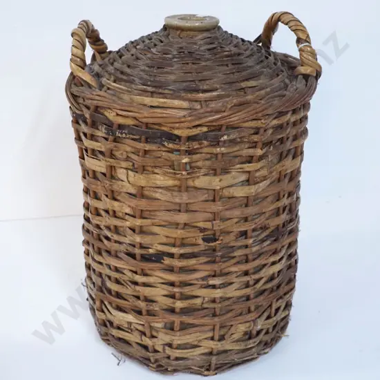 large stoneware crock in handled cane basket - no stopper H-530 D-300