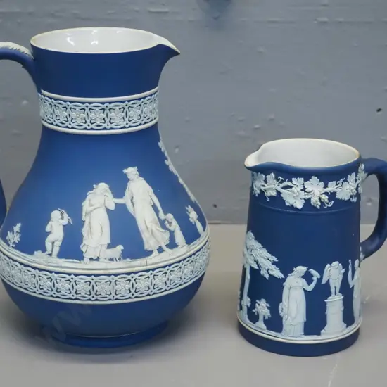 2  Wedgwood dark blue jasperware jugs - taller is H-180