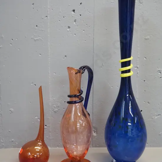 3 pieces of art glass - tall blue vase with yellow swirl H-505, orange jug with blue swirl, offset orange vase