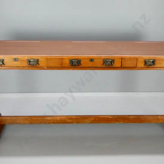 vintage kauri school desk with stretcher base, 3 drawers w/original drop handles, key escutcheons, top has been painted,