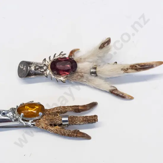 2 claw foot brooches