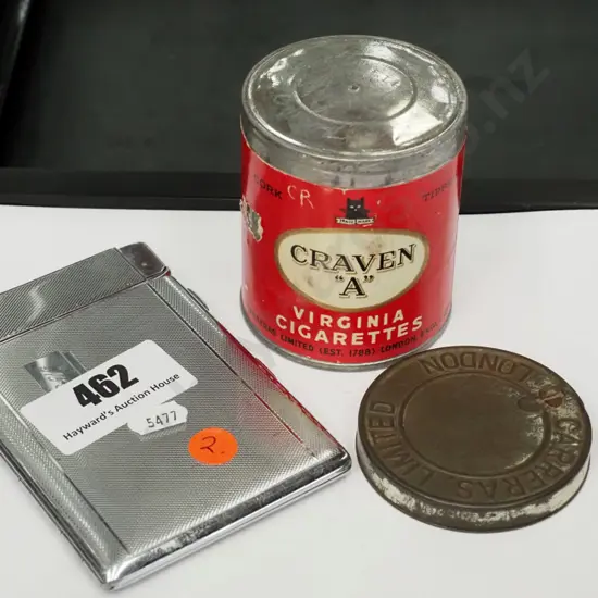 sealed tin of Craven A  Virginia cigarettes and a plated cigarette case with integrated lighter