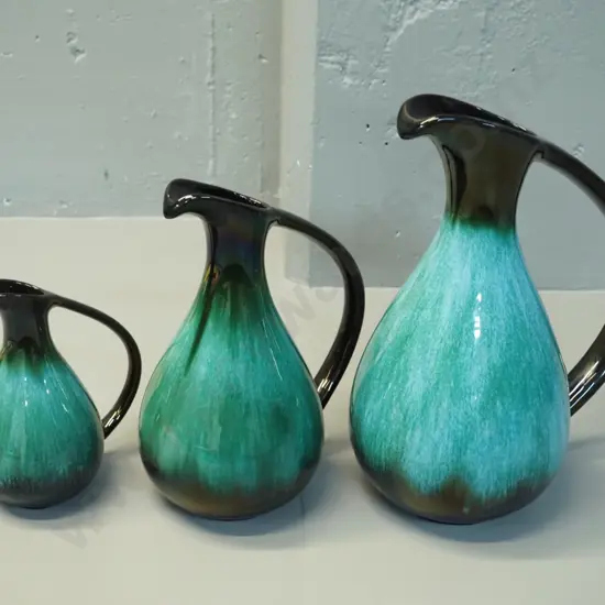 3 Blue Mountain teal glaze ewer jugs in graduated sizes, larger H-320 W-250