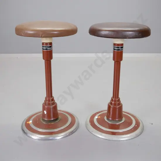 pair of Sterling brand vintage vinyl-upholstered swivelling stools on metal and cast iron bases H540 D290