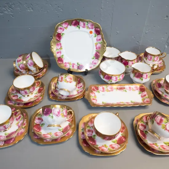 Royal Albert Old English Rose heavily gilded tea set with 10 trios (one non matching) cake plate, jugs etc