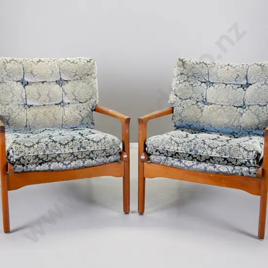 pair of mid-century mahogany framed lounge chairs covered in embossed blue velvet H-790 W-720 D-680