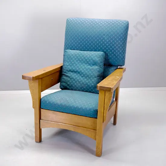 Arts & Crafts style reclining chair with pull-out foot rest, geometric teal damask upholtsery. Button release