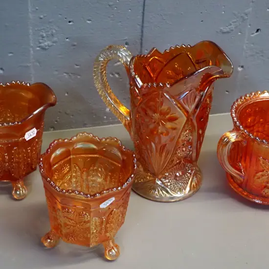 4 pieces marigold colour carnival glass - 2 jugs, vase and double handled pot, larger jug is H-190 W-160