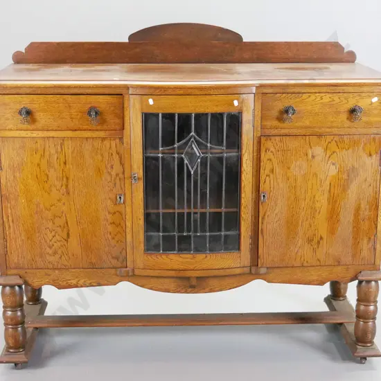 deco oak sideboard with 2 drawers, 2 solid and 1 leadlight doors, turned legs, stretcher base on casters - polish needs