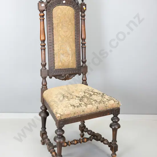 Jacobean style mahogany hall chair w/ carved back, stretcher base, some wear to tapestry fabric on seat. H1160 W460 D400