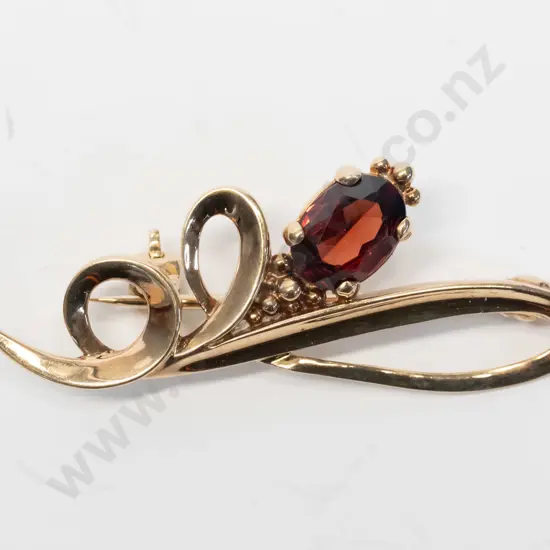 garnet brooch stamped 9ct